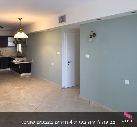 קיר צבוע בצבע ירוק בהיר עם מנורה תלויה